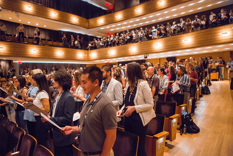 Attendees Standing in Venue